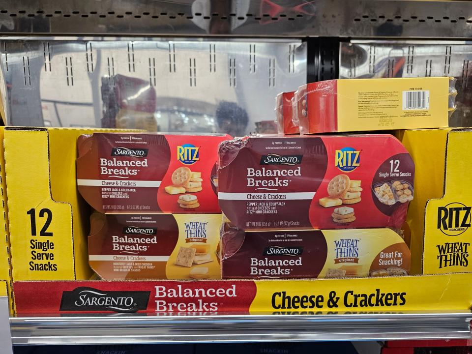 Balanced Breaks cheese and cracker packages in a Costco fridge