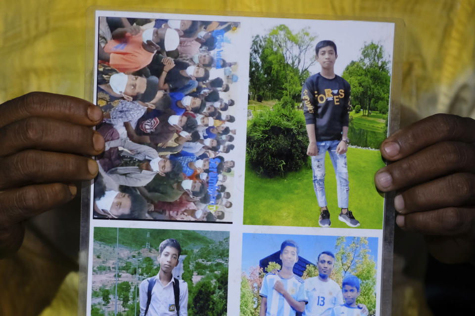 Rohingya refugee Muhammed Rashid holds photos of his son, Saiful Islam, at the Nayapara refugee camp in the Cox's Bazar district of Bangladesh, on March 7, 2023. Rashid believes he sees Saiful in the photo of a group of Rohingya refugees in Indonesia he found online, at top left. (AP Photo/Mahmud Hossain Opu)