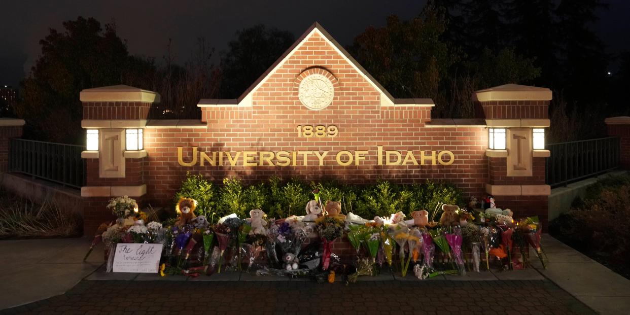 Flowers and other items are displayed at a growing memorial in front of a campus entrance sign for the University of Idaho, Wednesday, Nov. 16, 2022, in Moscow, Idaho.