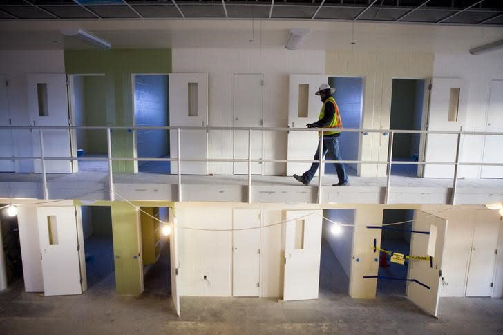 Grant Muscavitch, a superintendent with Balfour Beatty Construction, walks through a housing unit at the new San Diego County Women's Detention Facility during a media tour in Santee