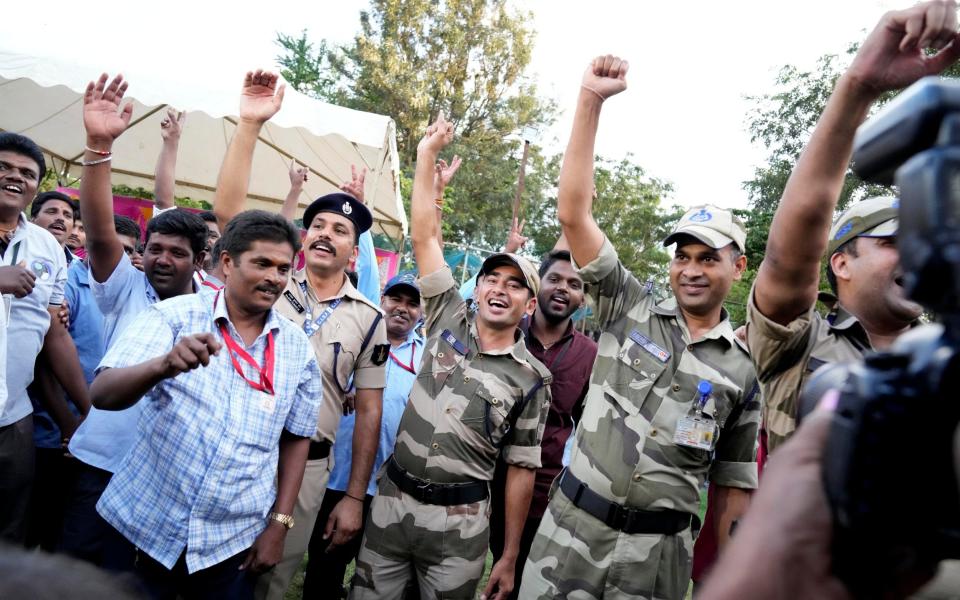 Indian security forces and Indian Space Research Organization (ISRO) staff celebrate the successful landing of spacecraft Chandrayaan-3