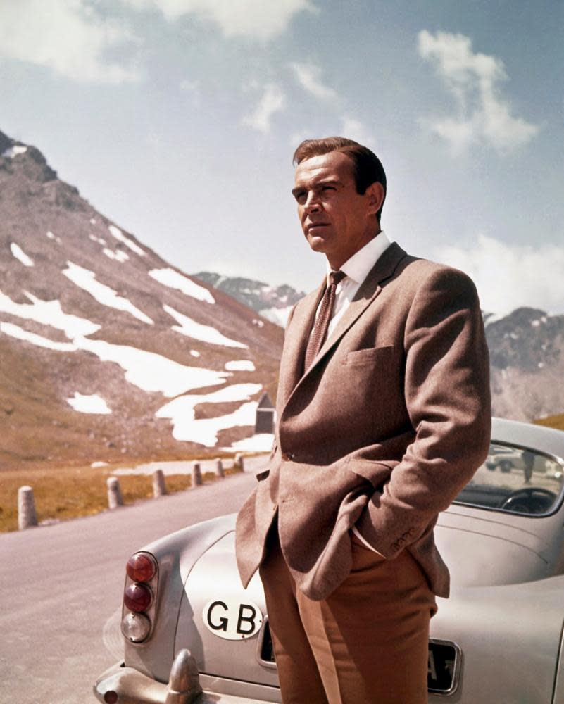 Actor Sean Connery as James Bond next to his Aston Martin DB5 in Goldfinger in 1964. Current Bond Daniel Craig says he should not lose every association with Ian Fleming’s chauvinist original.