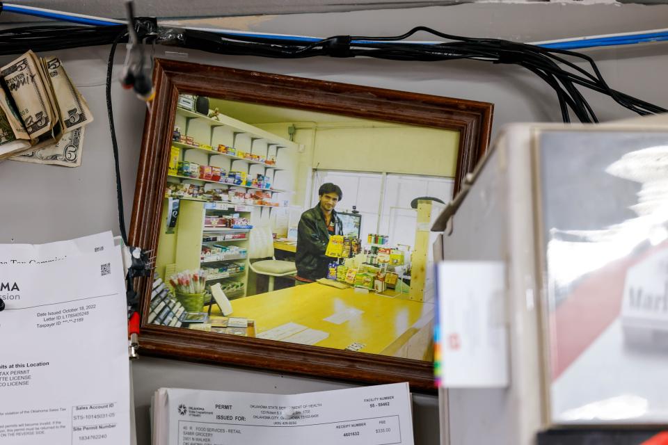 Samir Dhamani, shown in a photograph in his convenience store, Samir Groceries, said the friendly people of the Paseo Arts District, many of whom have become regulars and some of whom have become friends, keep him operating his beloved shop.