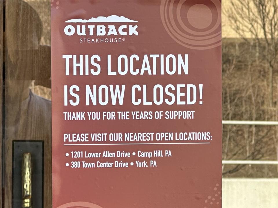 <em>Sign posted on Outback Steakhouse’s front door.</em>