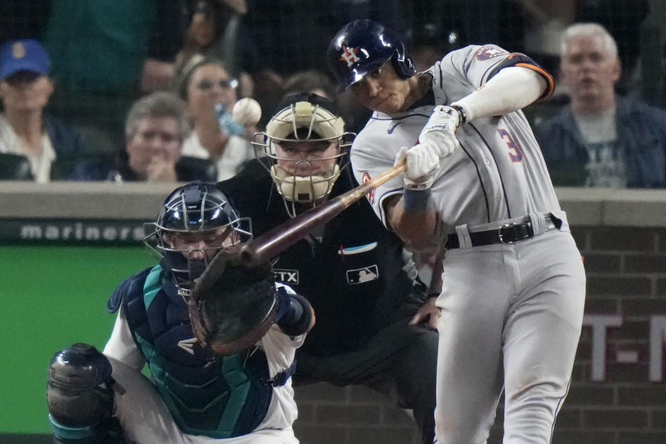 Houston Astros shortstop Jeremy Pena (3) hits a home run against the Seattle Mariners during the 18th inning in Game 3 of an American League Division Series baseball game Saturday, Oct. 15, 2022, in Seattle. (AP Photo/Stephen Brashear)