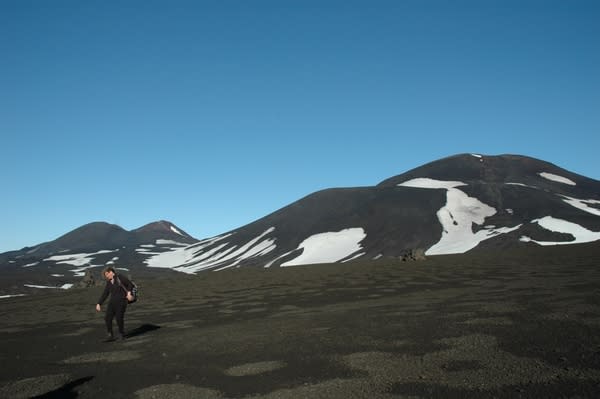 Terry Plank doing field research on the Seguam volcano in Alaska.