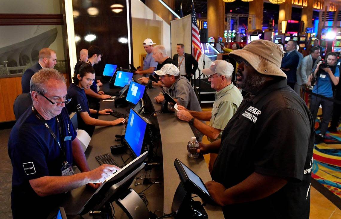 Legalized sports betting got underway Thursday in Kansas, including a location at the Hollywood Casino at Kansas Speedway, in Kansas City, Kansas. Among those to step up to the window was Doy Warden of Kansas City, Mo., right., who bet on several NFL games, including the Chiefs. “I wish Missouri would do this, they’re losing a lot of revenue to Kansas,” Warden said. The temporary Barstool Sportsbook consists of 30 sports betting kiosks and five betting windows with odds boards and 45 high-definition televisions. The casino plans on opening a permanent Barstool Sportsbook in the fall.