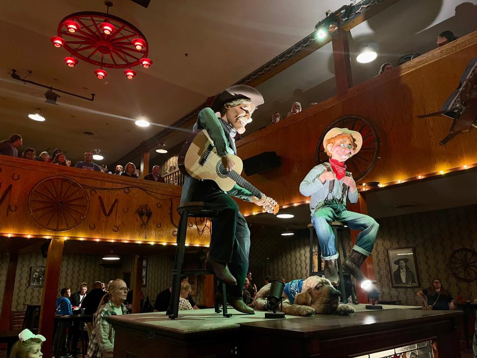 Dolly Parton's Stampede saloon with characters in the center