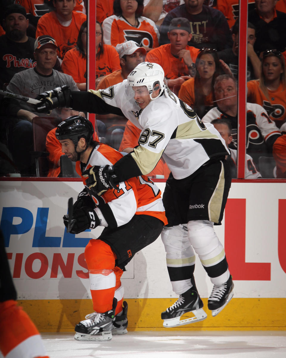 PHILADELPHIA, PA - APRIL 15: Sidney Crosby #87 of the Pittsburgh Penguins tries to get past Maxime Talbot #27 of the Philadelphia Flyers in Game Three of the Eastern Conference Quarterfinals during the 2012 NHL Stanley Cup Playoffs at Wells Fargo Center on April 15, 2012 in Philadelphia, Pennsylvania. The Flyers defeated the Penguins 8-4. (Photo by Bruce Bennett/Getty Images)