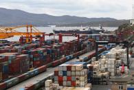 Stacked shipping containers are pictured at a commercial port in Vladivostok