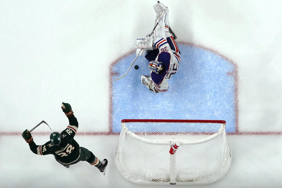 Minnesota Wild right wing Ryan Hartman (38) celebrates after a goal against Edmonton Oilers goalie Jack Campbell during the third period of an NHL hockey game Tuesday, Oct. 24, 2023, in St. Paul, Minn. (AP Photo/Abbie Parr)