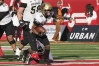 Colorado running back Alex Fontenot (8) runs out of the arms of Utah linebacker Devin Lloyd (0) in the first half of an NCAA college football game Friday, Nov. 26, 2021, in Salt Lake City. (AP Photo/George Frey)