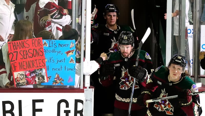 Arizona Coyotes' Logan Cooley, right, Michael Carcone (53) and Josh Doan arrive on the ice prior to the team's NHL hockey game against the Edmonton Oilers on Wednesday, April 17, 2024, in Tempe, Ariz.