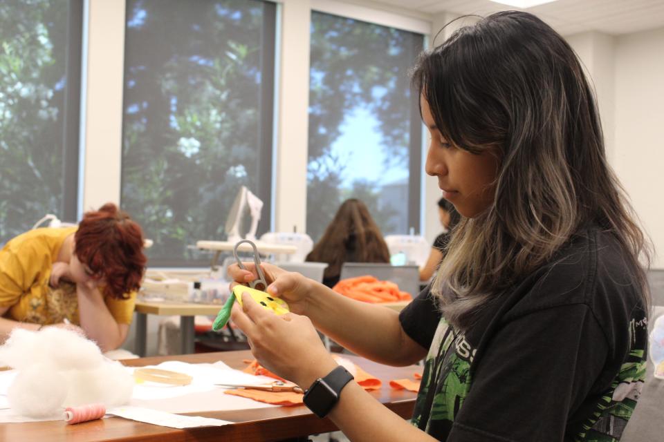 Aleena Aguirre, a McNair High School Student, constructs a 3D printing model as part of her final project for the innovation course at University of the Pacific's Summer High School Institute.