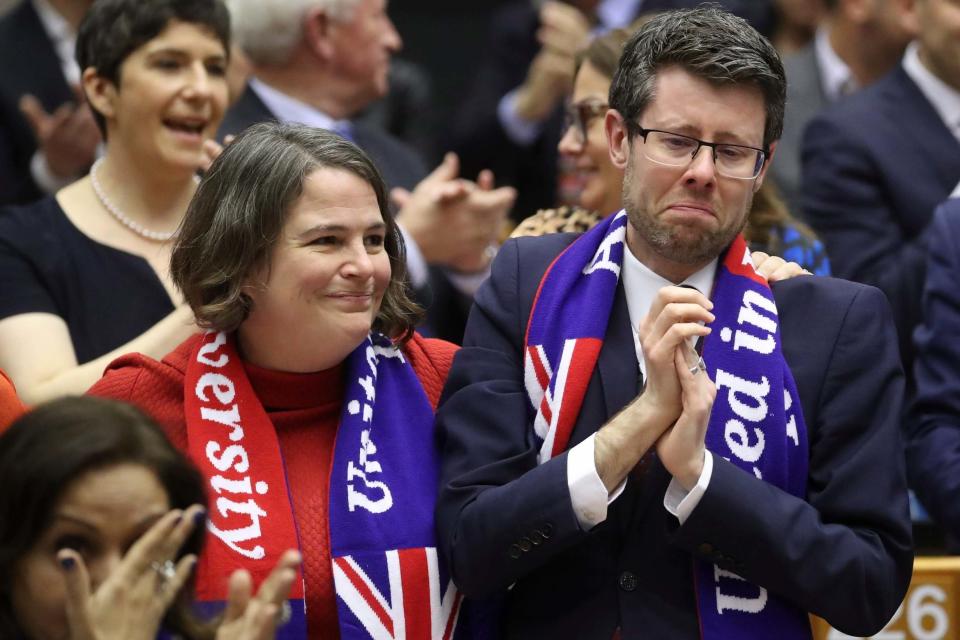 MEP's sing and wear banners after a vote on the UK's withdrawal from the EU (AP)