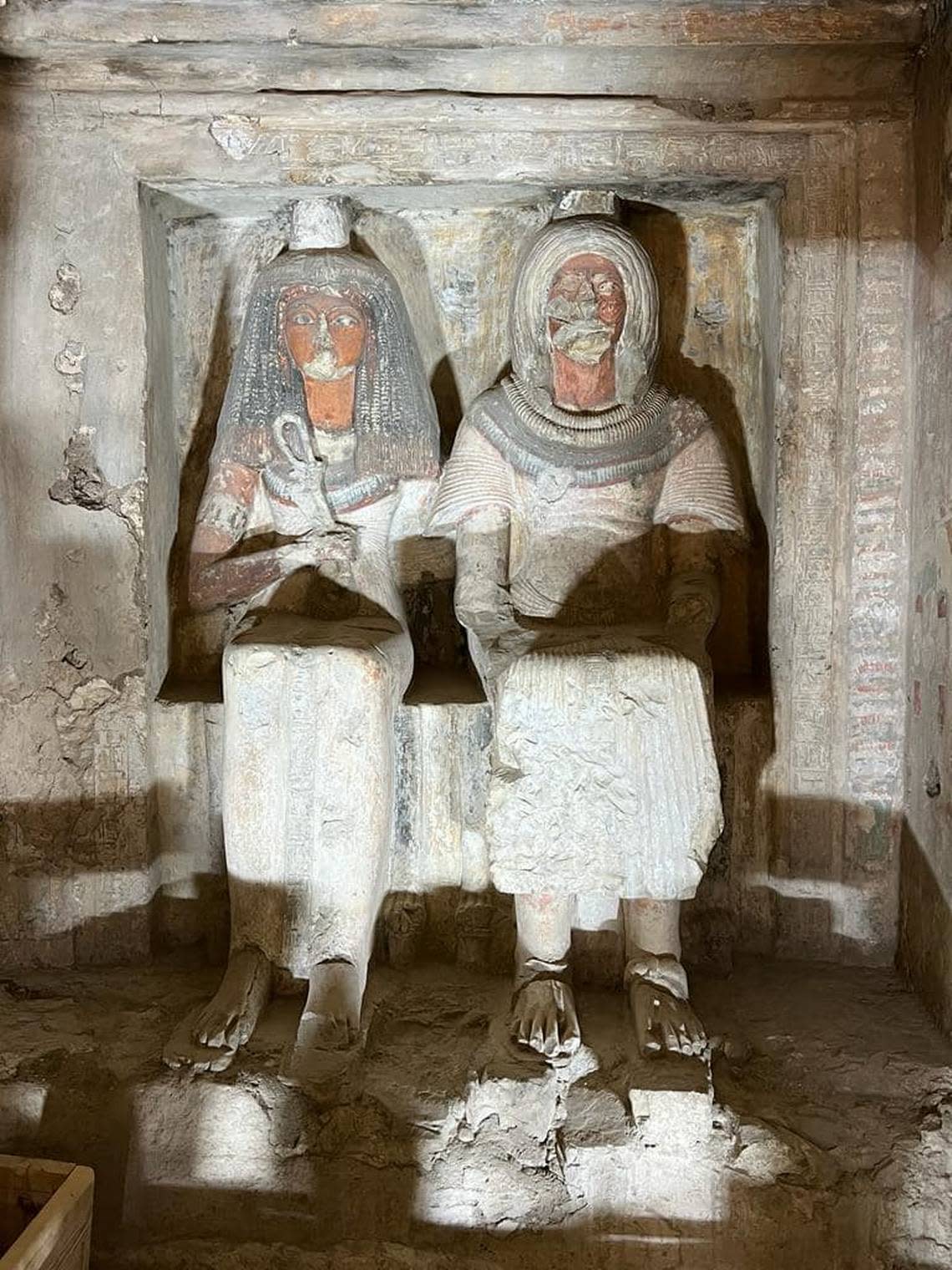 The statues of Neferhotep and his family inside his restored 3,300-year-old tomb.