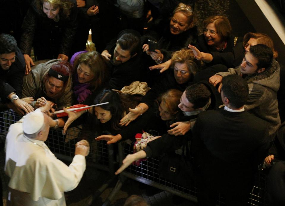 Pope Francis leaves after celebrating a Holy Mass at the Catholic Cathedral of the Holy Spirit in Istanbul November 29, 2014. (REUTERS/Stoyan Nenov)