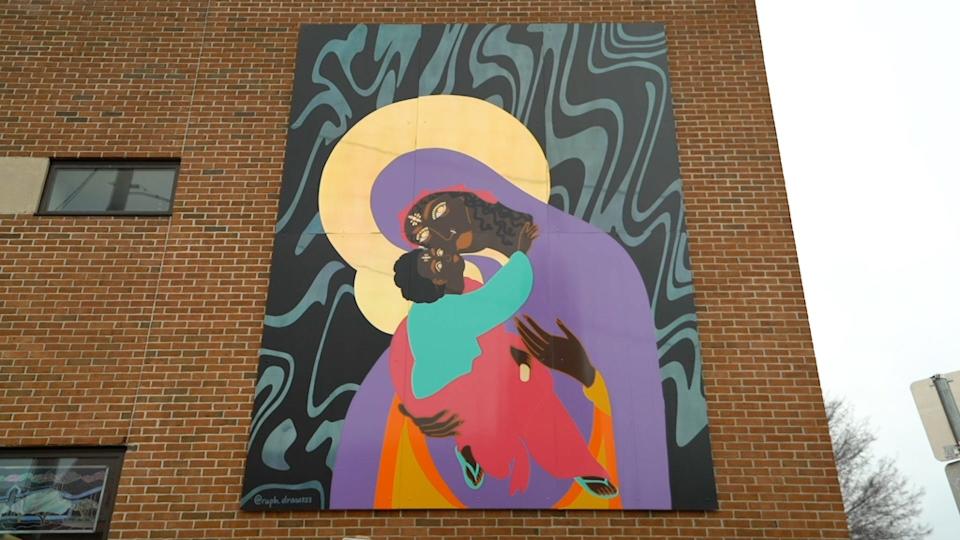 "Black Freedom, Black Madonna & the Black Child of Hope" by Raphaella "Raph" Brice decorates the east side of the Fletcher Free Library