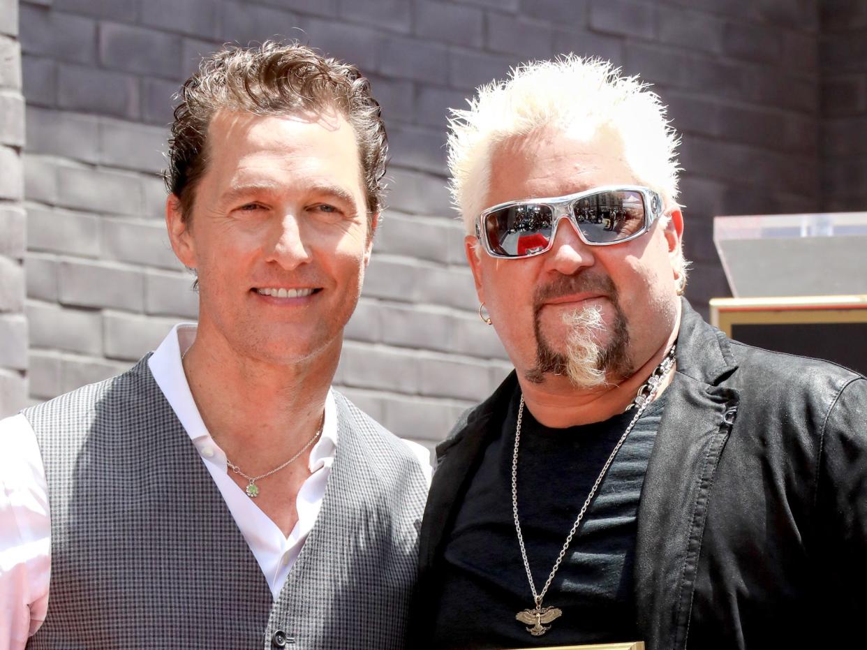Matthew McConaughey and Guy Fieri seen onstage at Guy Fieri's Star Ceremony On The Hollywood Walk Of Fame on May 22, 2019 in Hollywood, California from Getty Images 