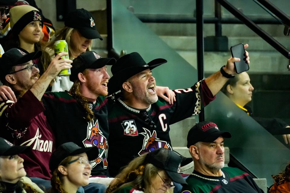 Coyotes fans sing during the second period of the Coyotes' home opener against the Anaheim Ducks at Mullett Arena on Oct. 21, 2023, in Tempe.