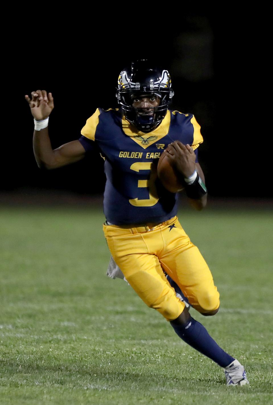 Desert Hot Springs quarterback Messiah Smith (3) runs the ball against Jurupa Valley in Desert Hot Springs, Calif., on August 25, 2023.