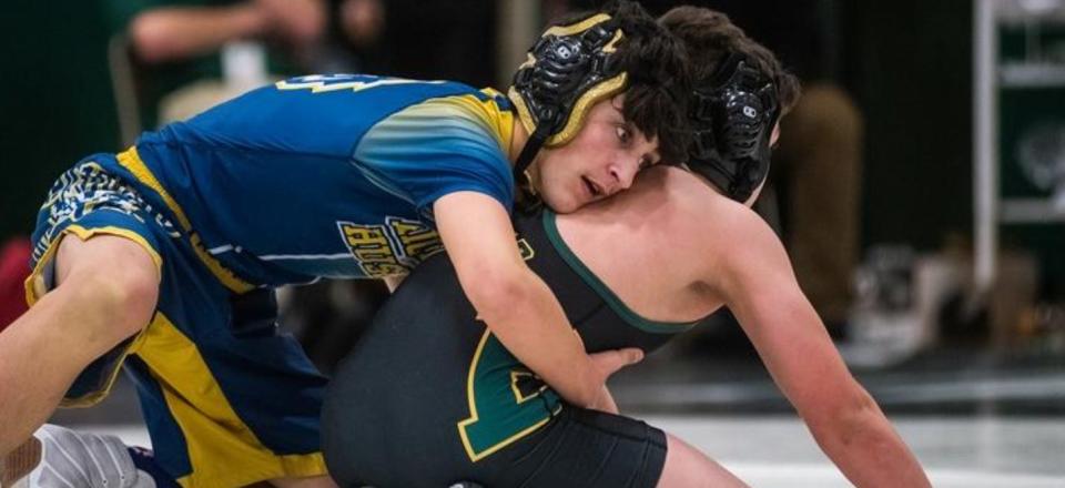 Highland’s Chris Gatto wrestles Eldred-Liberty-Sullivan West’s Patrick Adams.