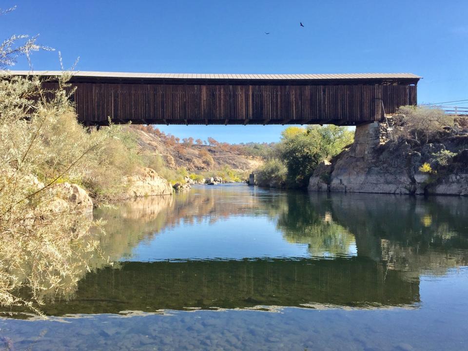 Knights Ferry covered bridge, circa 1864, stands high above the Stanislaus River.