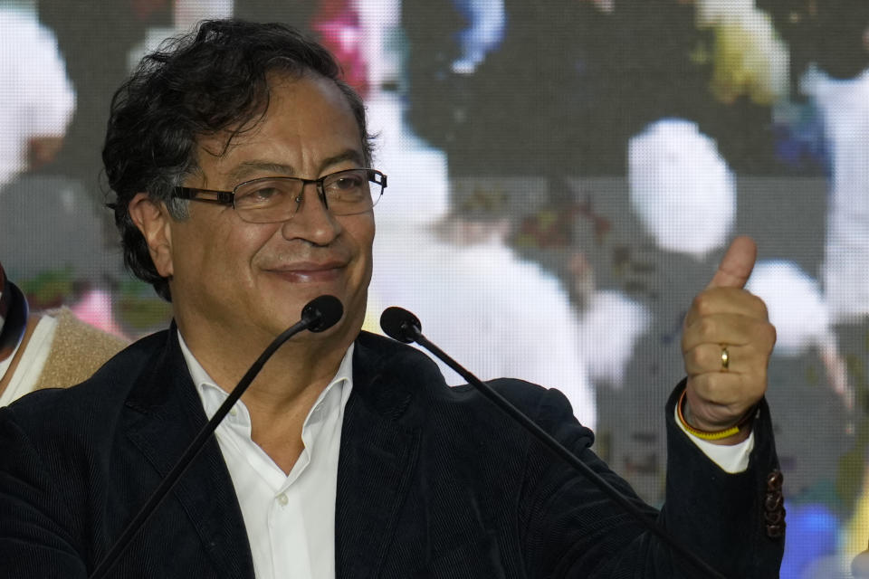 Presidential candidate Gustavo Petro, with the Historical Pact coalition, gives a thumbs up to supporters on election night in Bogota, Colombia, Sunday, May 29, 2022. Petro will advance to a runoff contest in June after none of the six candidates in Sunday's first round got half the vote. (AP Photo/Fernando Vergara)