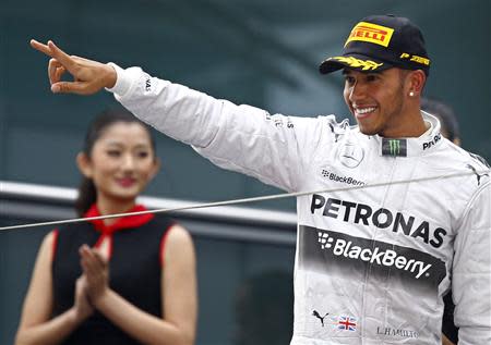 First-placed Mercedes Formula One driver Lewis Hamilton of Britain gestures after winning the Chinese F1 Grand Prix at the Shanghai International Circuit April 20, 2014. REUTERS/Carlos Barria