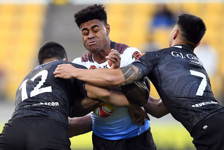 Rugby League World Cup - New Zealand vs Fiji - Wellington Regional Stadium, Wellington, New Zealand, November 18, 2017. Fiji's Kevin Naiqama is tackled by New Zealand's Joseph Tapine and Shaun Johnson during their quarter final match. REUTERS/Stringer