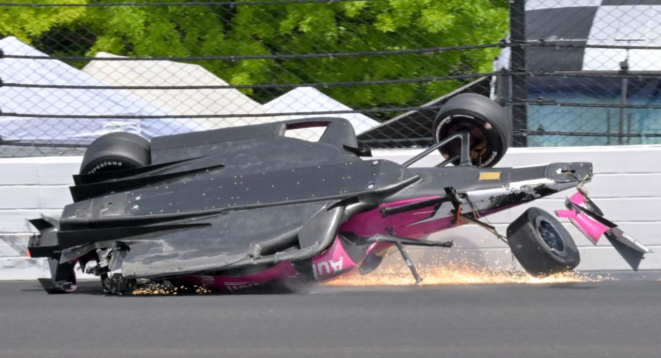 Andretti Autosport driver Kyle Kirkwood (27) slides across the pavement through the second turn after a crash with Arrow McLaren SP driver Felix Rosenqvist (not pictured) during the 107th running of the Indianapolis 500 at Indianapolis Motor Speedway.