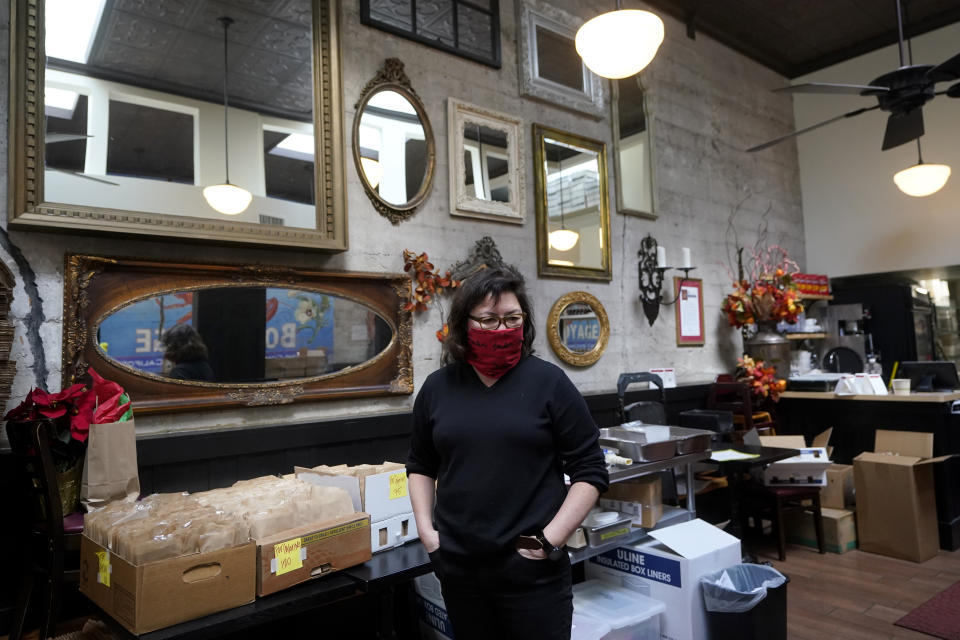 Chef Proprieter Brenda Buenviaje stands in her restaurant while interviewed at Brenda's French Soul Food in San Francisco, Wednesday, Dec. 9, 2020. In pre-pandemic days, Brenda's French Soul Food was always hopping, but everything came to a screeching halt on March 16, when San Francisco halted indoor dining to stop the spread of the coronavirus. It reopened for takeout and delivery, and Buenviaje is now shipping meals nationwide through a service called Goldbelly. (AP Photo/Jeff Chiu)