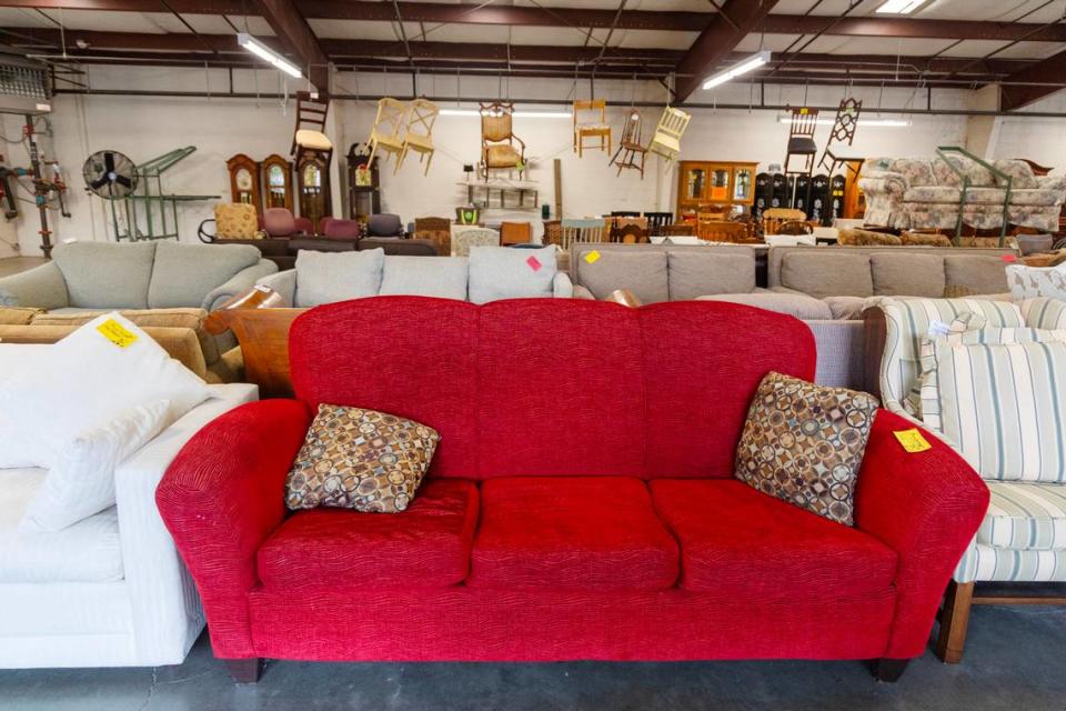 The Bench Commission sells gently used furniture, like this red couch.