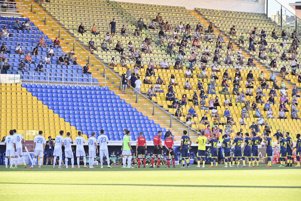 Fans wait for the start of a friendly match between Parma and Empoli at the Ennio Tardini stadium in Parma Sunday, Sept. 6, 2020. For the first time since the start of the COVID-19 pandemic, the stadium was opened for 1,000 fans. (Massimo Paolone/LaPresse via AP)