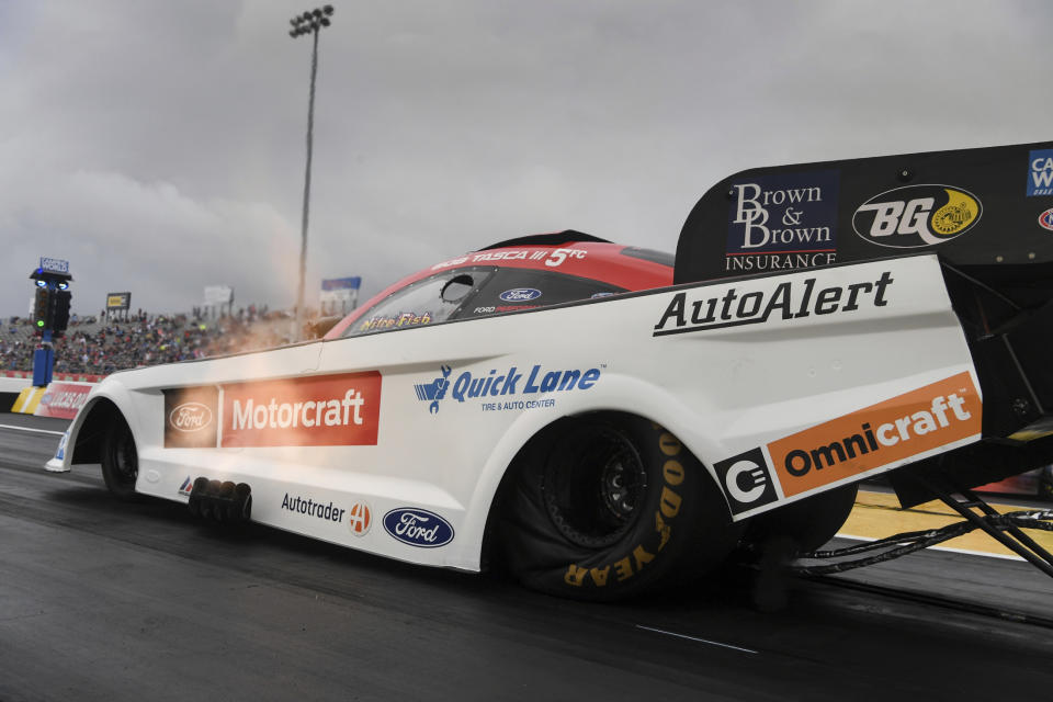 In this photo provided by the NHRA, Bob Tasca III makes a run in Funny Car qualifying Saturday, May 22, 2021, for the Mopar Express Lane NHRA SpringNationals drag races at Houston Raceway Park in Baytown, Texas. (Jerry Foss/NHRA via AP)
