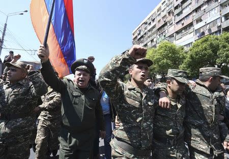 People march during a protest against the appointment of ex-president Serzh Sarksyan as the new prime minister in Yerevan, Armenia April 23, 2018. REUTERS/Vahram Baghdasaryan/Photolure