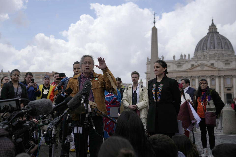 FILE - Gerald Antoine, center, First Nations NWT Regional Chief, is flanked by Natan Obed, president of Inuit Tapiriit Kanatami delegation, left, and Cassidy Caron, President of the Metis community, as they meet reporters in St.Peter's Square, at the Vatican, after their meeting with Pope Francis, Friday, April 1, 2022. The restitution of Indigenous and colonial-era artifacts, a pressing debate for museums and national collections across Europe, is one of the many agenda items awaiting Francis on his trip to Canada, which begins Sunday. (AP Photo/Alessandra Tarantino, File)