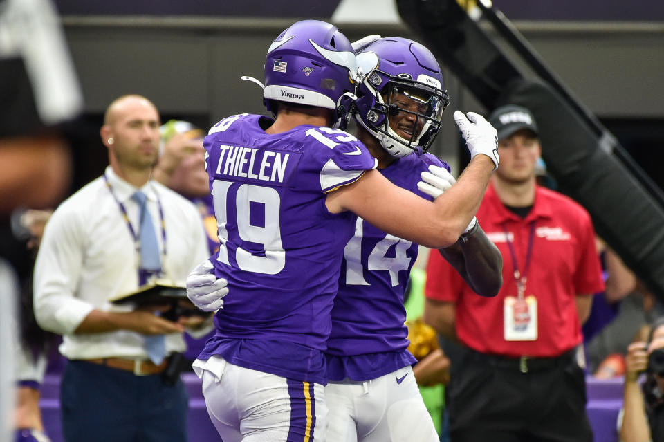Sep 22, 2019; Minneapolis, MN, USA; Minnesota Vikings wide receiver Adam Thielen (19) and wide receiver Stefon Diggs (14) react after a touchdown by Thielen during the second quarter against the Oakland Raiders at U.S. Bank Stadium. Mandatory Credit: Jeffrey Becker-USA TODAY Sports