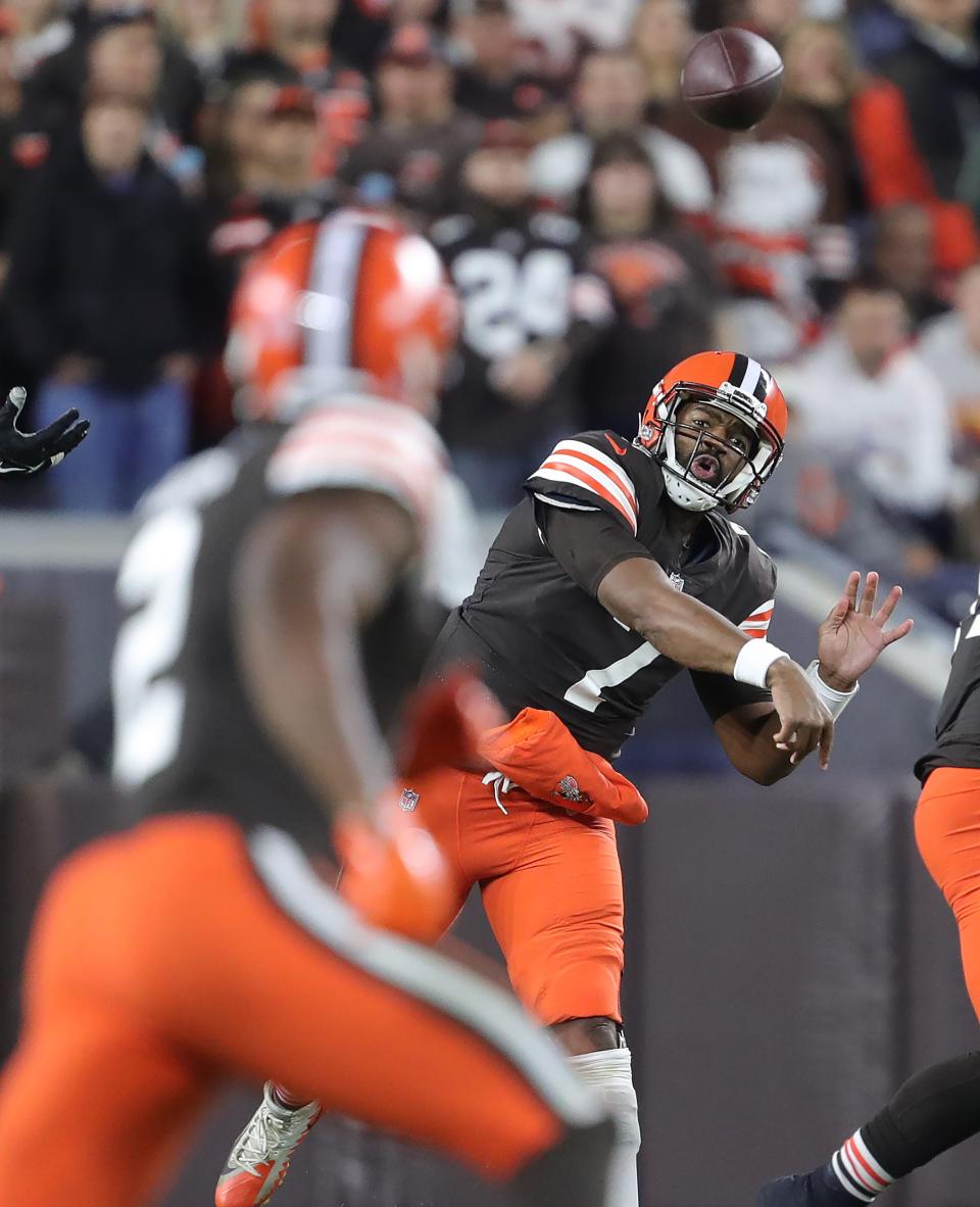 Browns quarterback Jacoby Brissett throws a first-half pass to wide receiver Amari Cooper, Monday, Oct. 31, 2022, in Cleveland.