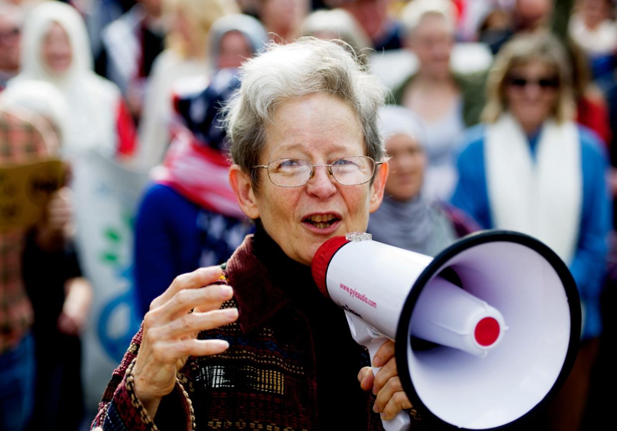 Fran Ansley speaks during a silent march in 2017 protesting immigration and refugee bans. She was a staunch community advocate for immigrants' rights.