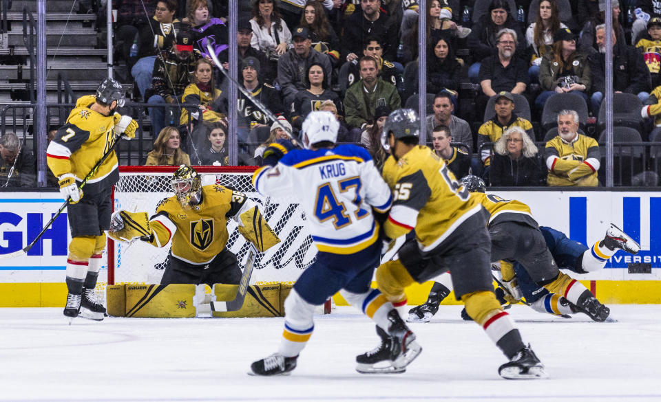 Vegas Golden Knights goaltender Logan Thompson (36) makes a save on a shot by St. Louis Blues defenseman Torey Krug (47) during the third period of an NHL hockey game Friday, Dec. 23, 2022, in Las Vegas. (AP Photo/L.E. Baskow)