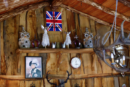 An oil painting of the Queen Elizabeth is pictured in "Robin Hood's hut" at the British curiosities collection "Little Britain" of Gary Blackburn, a 53-year-old tree surgeon from Lincolnshire, Britain, in Linz-Kretzhaus, south of Germany's former capital Bonn, Germany, August 24, 2017. REUTERS/Wolfgang Rattay