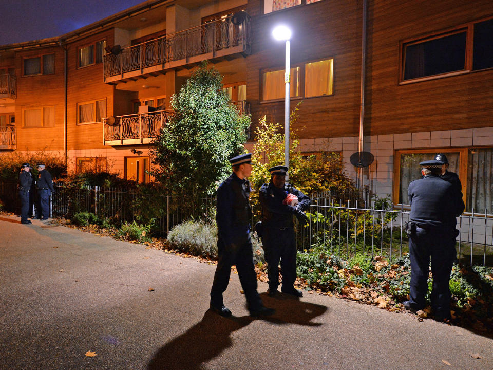 Police outside flats in Brixton, south London, in 2013. Three women had reportedly been held captive there for 30 years: AFP/Getty