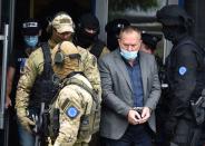 Special police units from EULEX arrest Hysni Gucati, leader of Kosovo Liberation Army War Veterans Organisation in Pristina