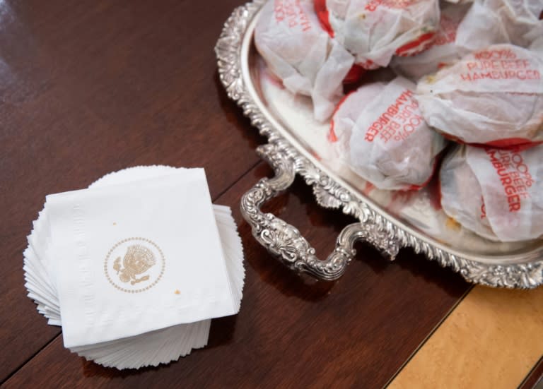 Hamburgers are served at the White House with napkins bearing the presidential seal