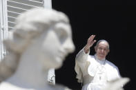 Pope Francis delivers his blessing from the window of his studio overlooking St. Peter's Square, at the Vatican, Sunday, May 24, 2020. For the first time in months, well-spaced faithful gathered in St. Peter’s Square for the traditional Sunday papal blessing, casting their gaze at the window where the pope normally addresses the faithful, since the square had been closed due to anti-coronavirus lockdown measures. (AP Photo/Andrew Medichini)