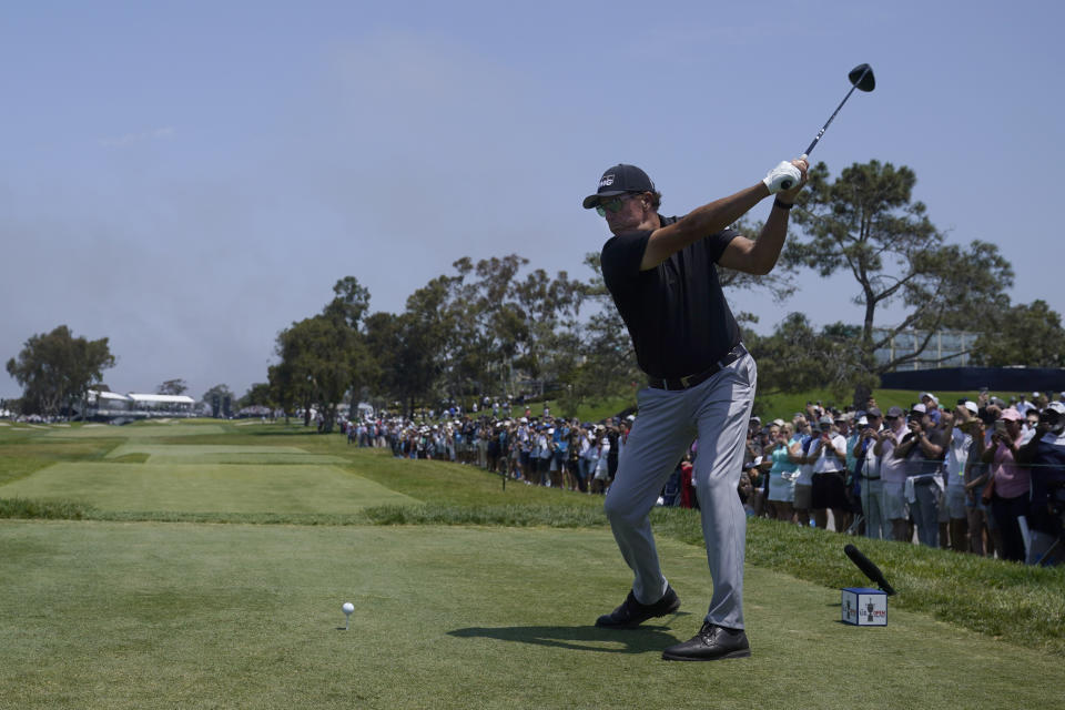 Phil Mickelson plays his shot from the 18th tee during the first round of the U.S. Open Golf Championship, Thursday, June 17, 2021, at Torrey Pines Golf Course in San Diego. (AP Photo/Marcio Jose Sanchez)