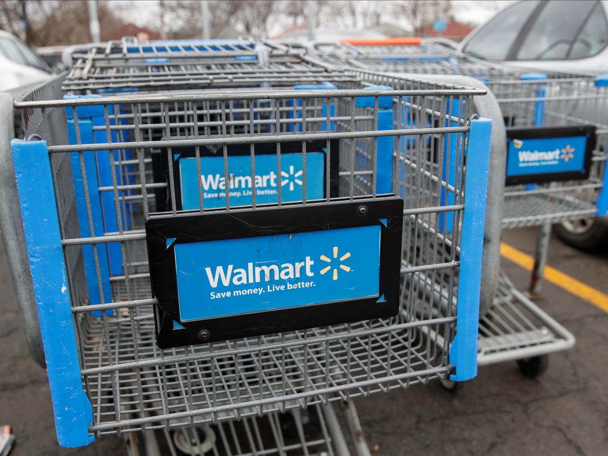 FILE PHOTO: Walmart shopping carts are seen on the parking lot ahead of the Thanksgiving holiday in Chicago, Illinois, U.S. November 27, 2019. REUTERS/Kamil Krzaczynski