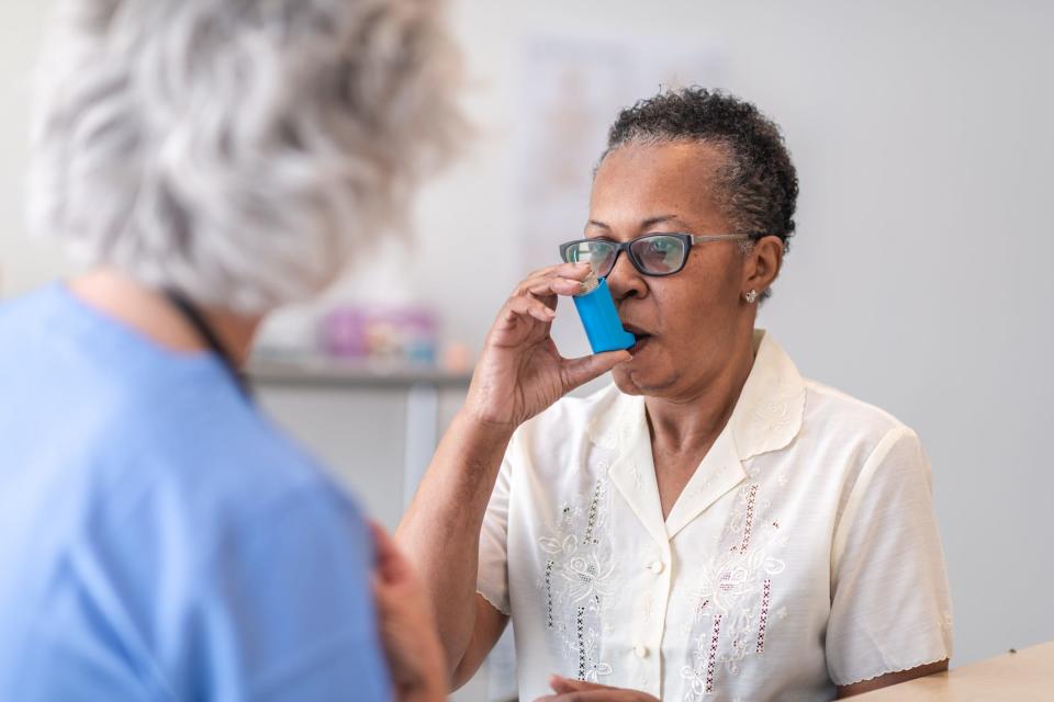 A woman uses an Asthma inhaler. Spring allergies can exacerbate Asthma and COPD.