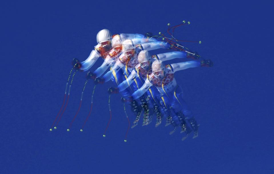 Bosnia and Herzegovina's Igor Laikert goes airborne during the downhill run of the men's alpine skiing super combined event at the 2014 Sochi Winter Olympics at the Rosa Khutor Alpine Center February 14, 2014. Picture taken with multiple exposure function. REUTERS/Stefano Rellandini